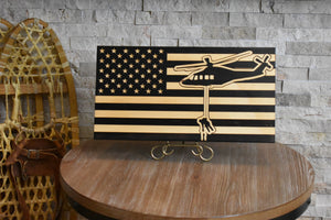 Staged photo of flag with engraving a search and rescue team