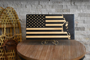 Staged photo of flag with engraving a rock climber